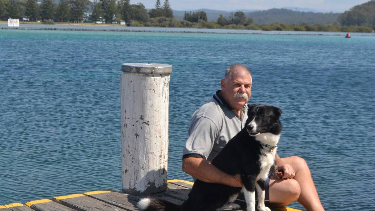 NAROOMA: Retired police officer and dog handler Rod Howard of Narooma has been recognised with a Bravery Medal. He is pictured with his new dog, Kurt, who he adopted after it failed tests to become a prison dog.