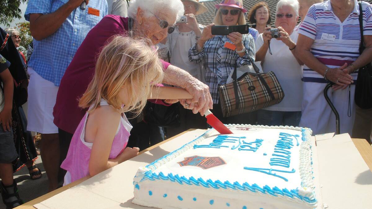 NAROOMA: The oldest and youngest Narooma Public School students were chosen to cut the cake at the Narooma Public School 125th Anniversary. Pictured are 92-year-old Rene Bennett and the youngest Narooma Public School student Caprice Rose. The cake was baked by Barry Mead at the ABC Bakery.