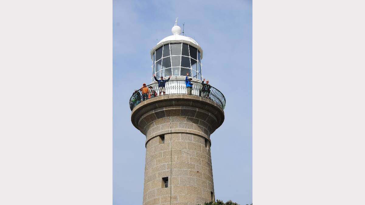 MONTAGUE: In their element, US Lighthouse Society members up the top of Montague Island Lighthouse on Monday. The society brought over 47 of its members from America to tour lighthouses up and down the East Coast. 