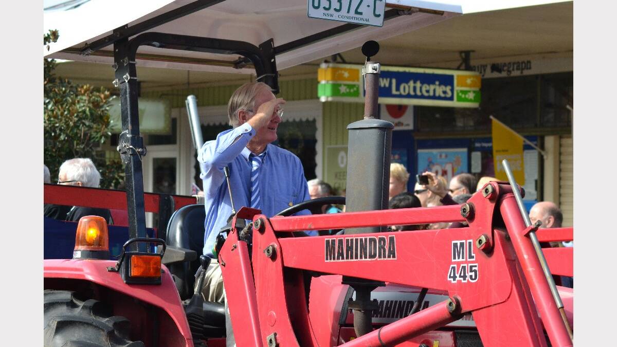 A tractor transports the Berry Silver Band during the 2014 Berry Anzac Day march down Queen Street.
