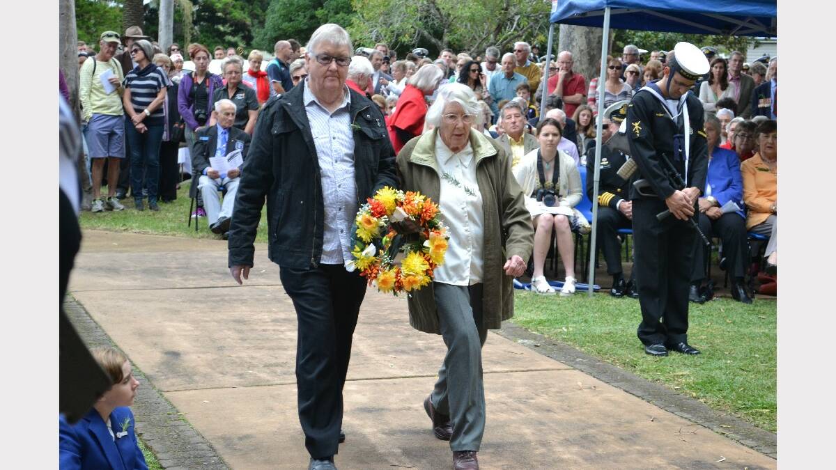 A wreath is laid by Peter Anderson and Edith Faulks in memory of Flight Sergeant John Anderson of Berry.