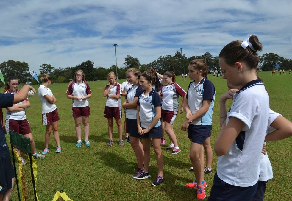 A quick instruction on baseball and the Vincentia and Nowra high school teams were into it during the Girls Get Active Schools Day in Bomaderry.