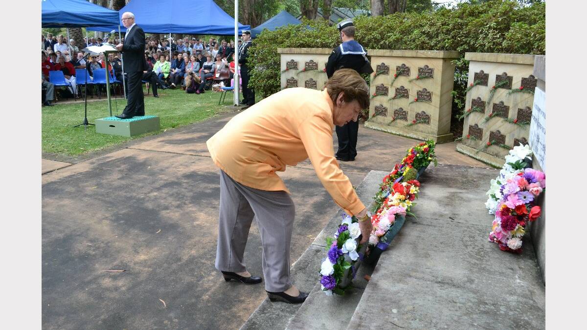 A wreath is laid on behalf of the Federal Member for Gilmore Ann Sudmalis.