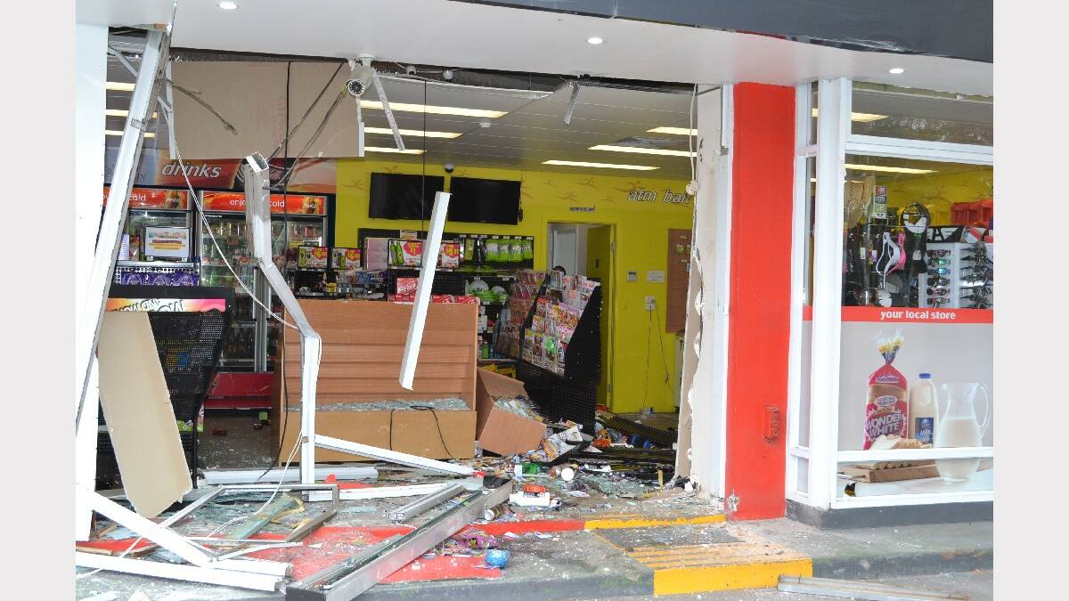 The damage caused by the theft of an ATM machine at Fast and Ezy store and Shell garage at Wandandian on Monday morning.