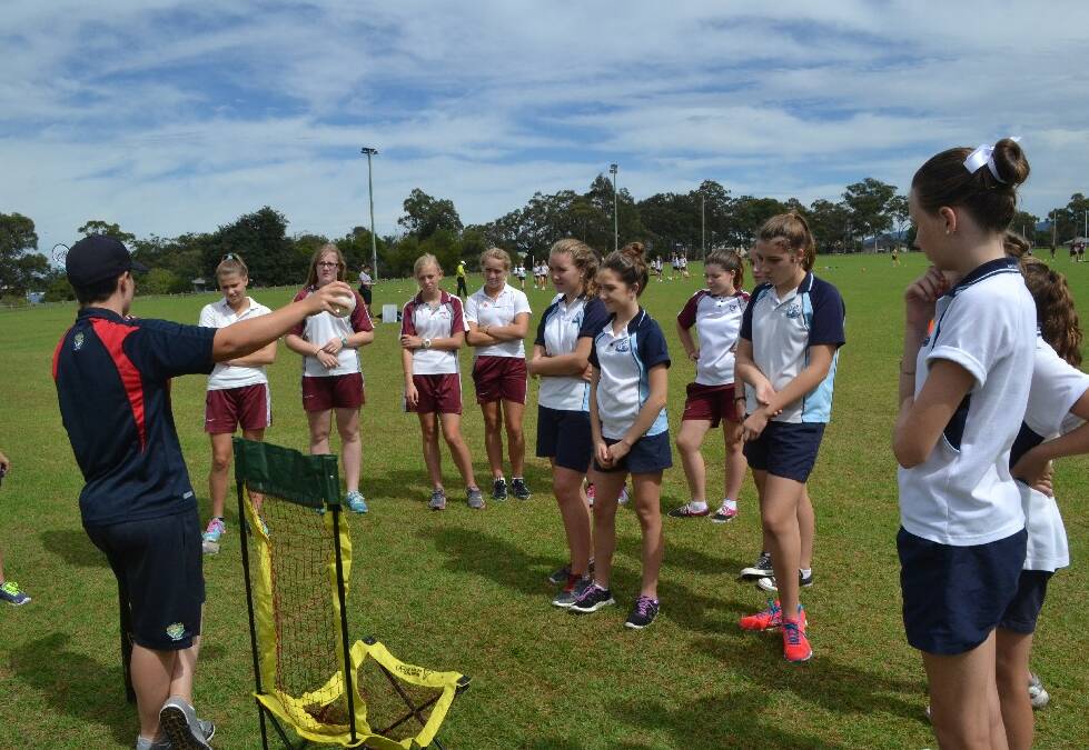 A quick instruction on baseball and the Vincentia and Nowra high school teams were into it during the Girls Get Active Schools Day in Bomaderry.