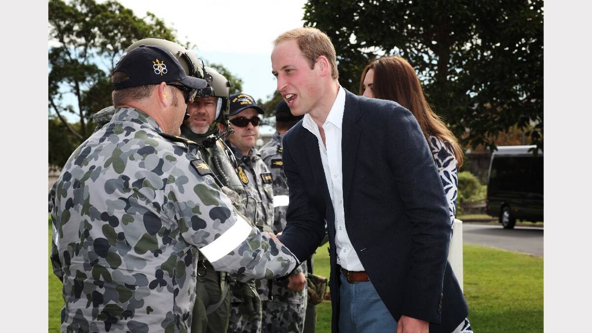 The Duke and Duchess of Cambridge are greeted by Australian Defence Force personnel of 808 Squadron before entering the MRH90 helicopter at Victoria Barracks to fly to Winmalee in the Blue Mountains.