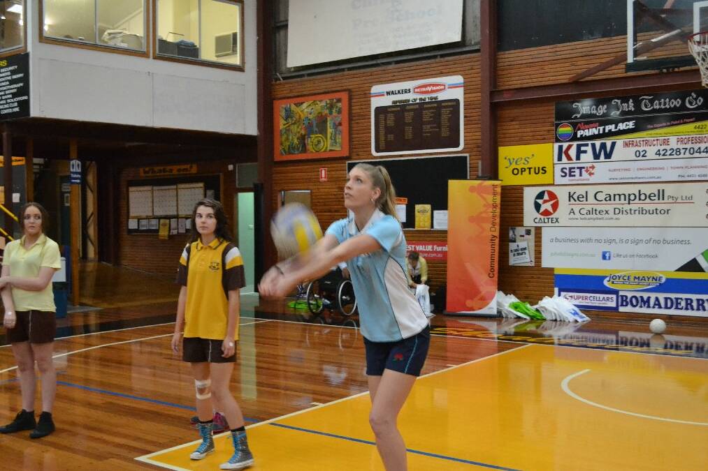 Under 23 NSW volleyball rep Lacey Bruce from Nowra demonstrates a dig during the Girls Get Active Schools Day.