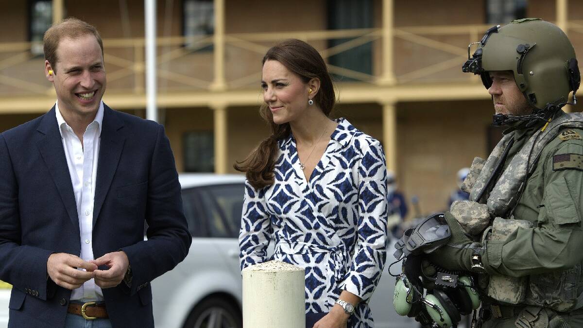 The Duke and Duchess of Cambridge are greeted by Australian Defence Force personnel from 808 Squadron before entering the MRH90 helicopter at Victoria Barracks, Sydney.