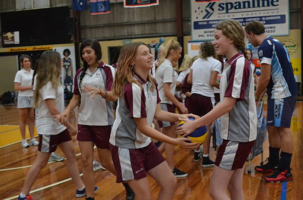 Vincentia High School year 8 students April Johnston and Jennifer Carrol on the volleyball court during the Girls Get Active Schools Day.