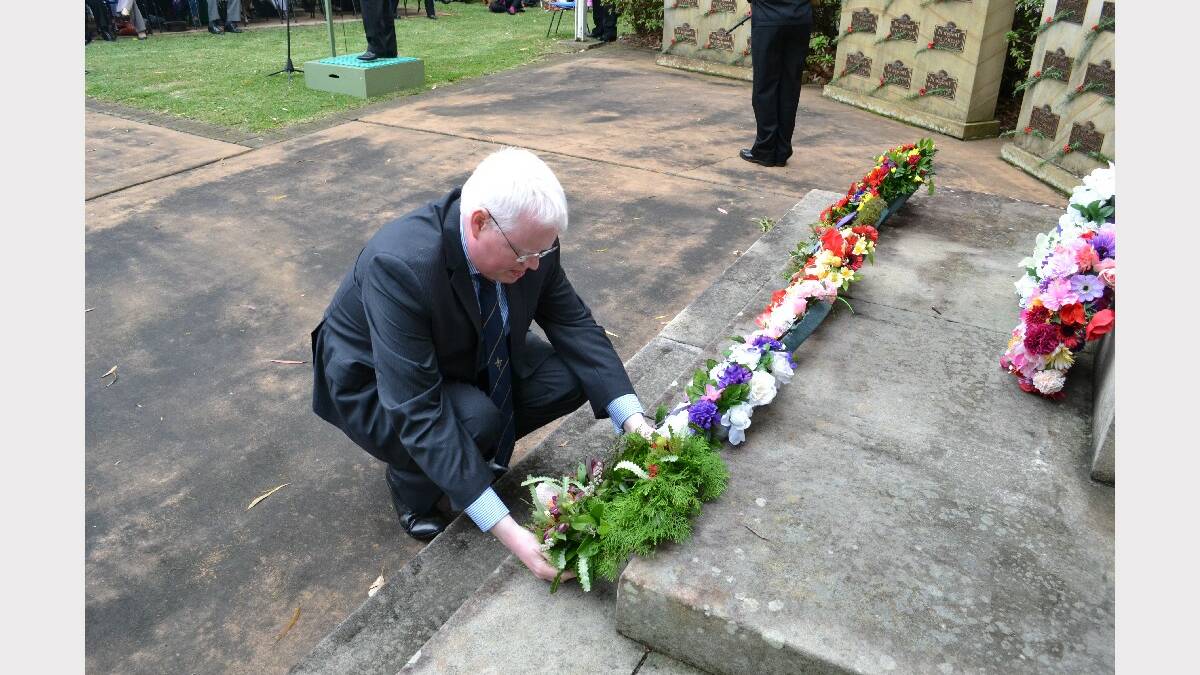 Federal Member for Kiama Gareth Ward lays a wreath.