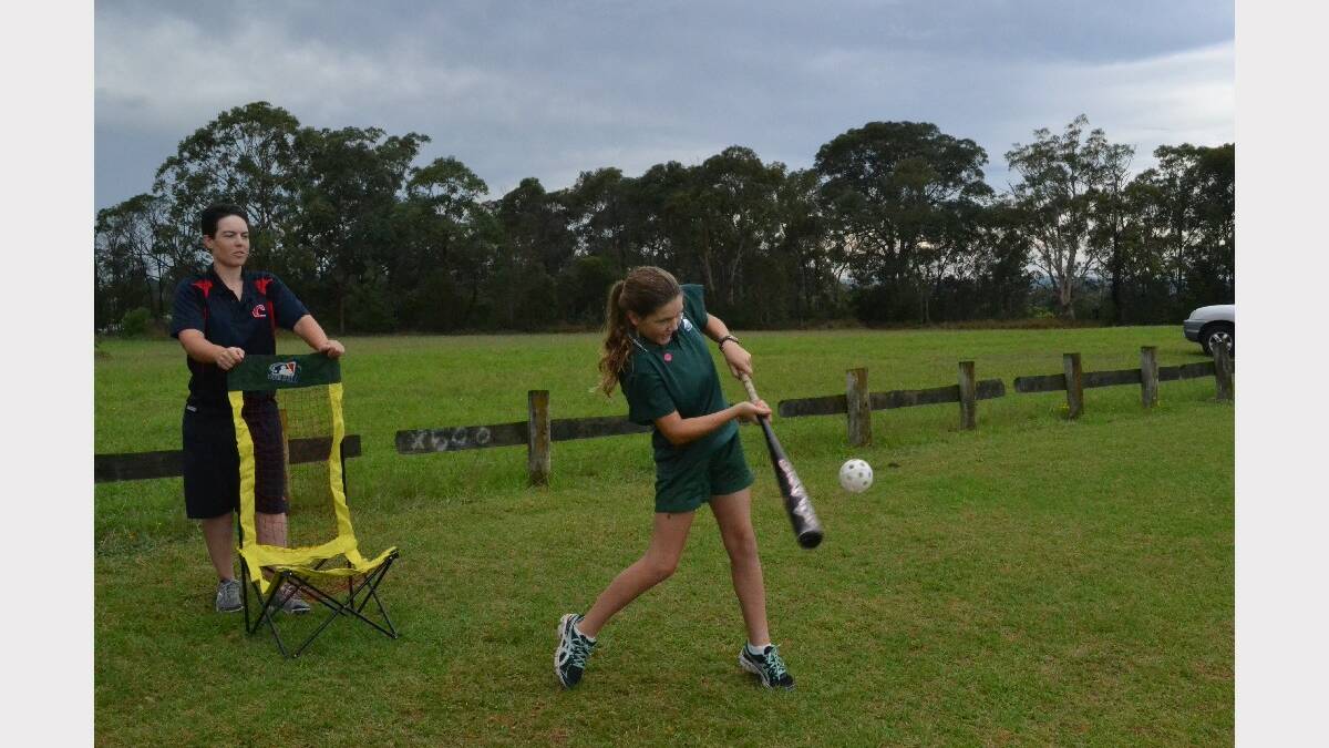 Ulladulla High School year 8 student Olivia Chopping smashes the ball during the Girls Get Active Schools Day.