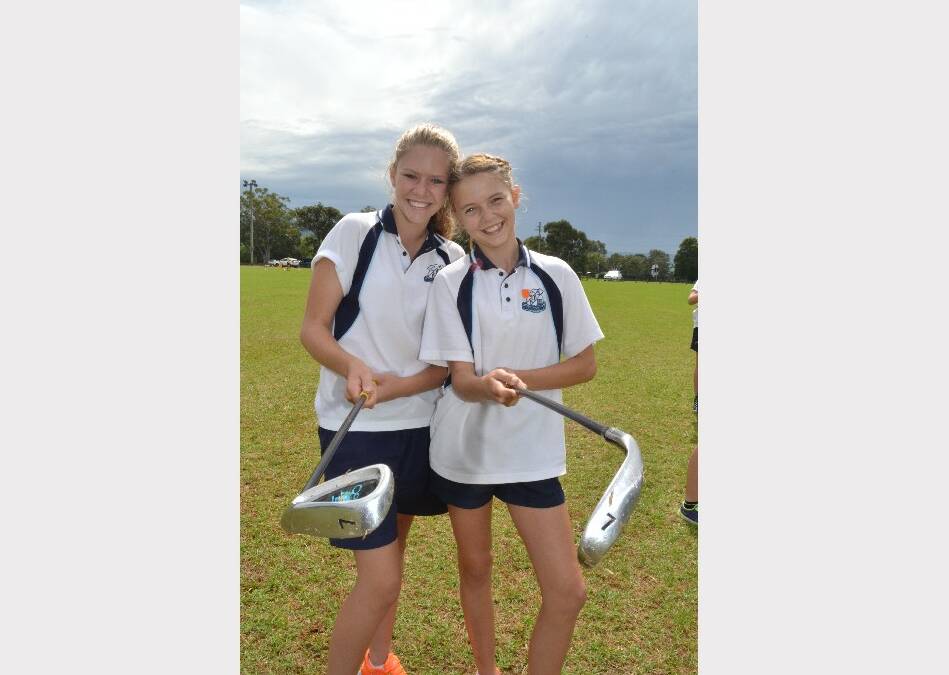 Kiralee Moulds and Jacinta Jay from Nowra High School having a go at golf during the Girls Get Active Schools Day in Bomaderry.