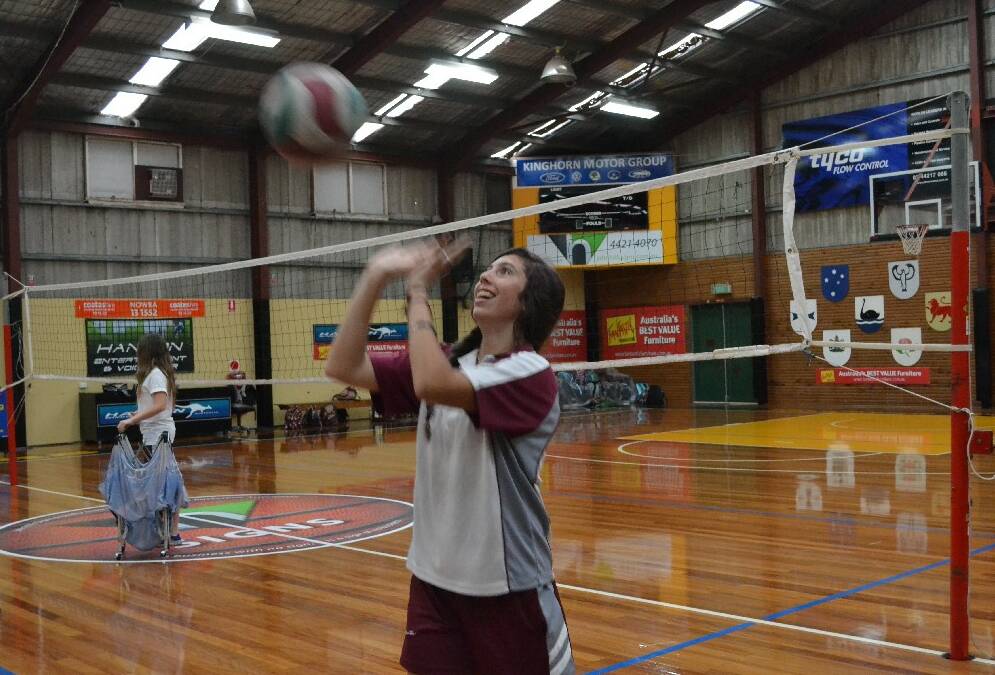 Vincentia High School year 8 student Scarlett Lea sets the volley ball during the Girls Get Active Schools Day.