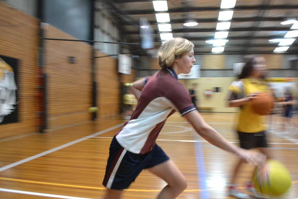 Alanna Smith from Shoalhaven Anglican School shoots past during the Girls Get Active Schools Day.