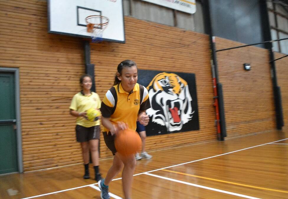Emma Tanoai from Shoalhaven High School dribbles the ball at Shoalhaven Basketball Court during the Girls Get Active Schools Day.