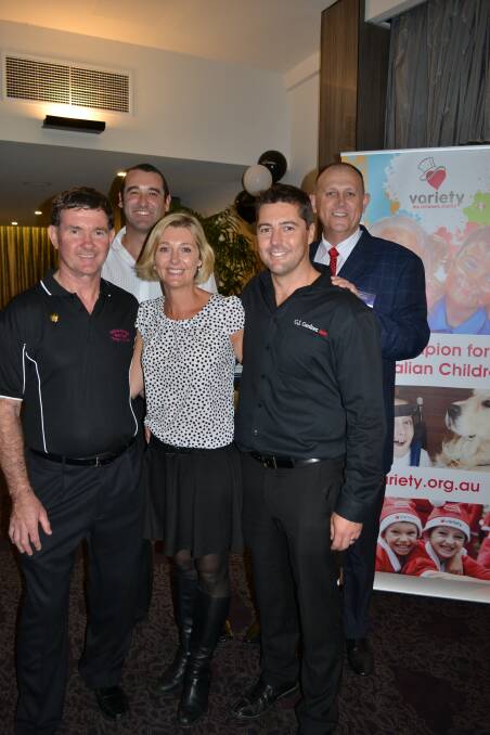 HUGE EFFORT: Brian Muller from Variety South Coast, Kirsty Fay, Sean Vickery and Nathan Fay from GJ Gardner Homes and Peter Perrin from 2ST/PowerFM celebrate the completion of the GJ Variety Freedom House at Bomaderry Bowling Club on Thursday.