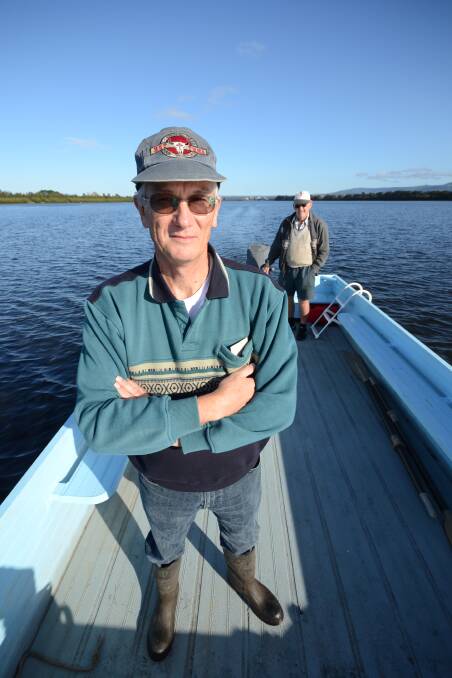 RUBBISH PATROL: Riverwatch treasurer John Tate, with Charlie Weir at the helm, gears up for Sunday’s big clean-up.
