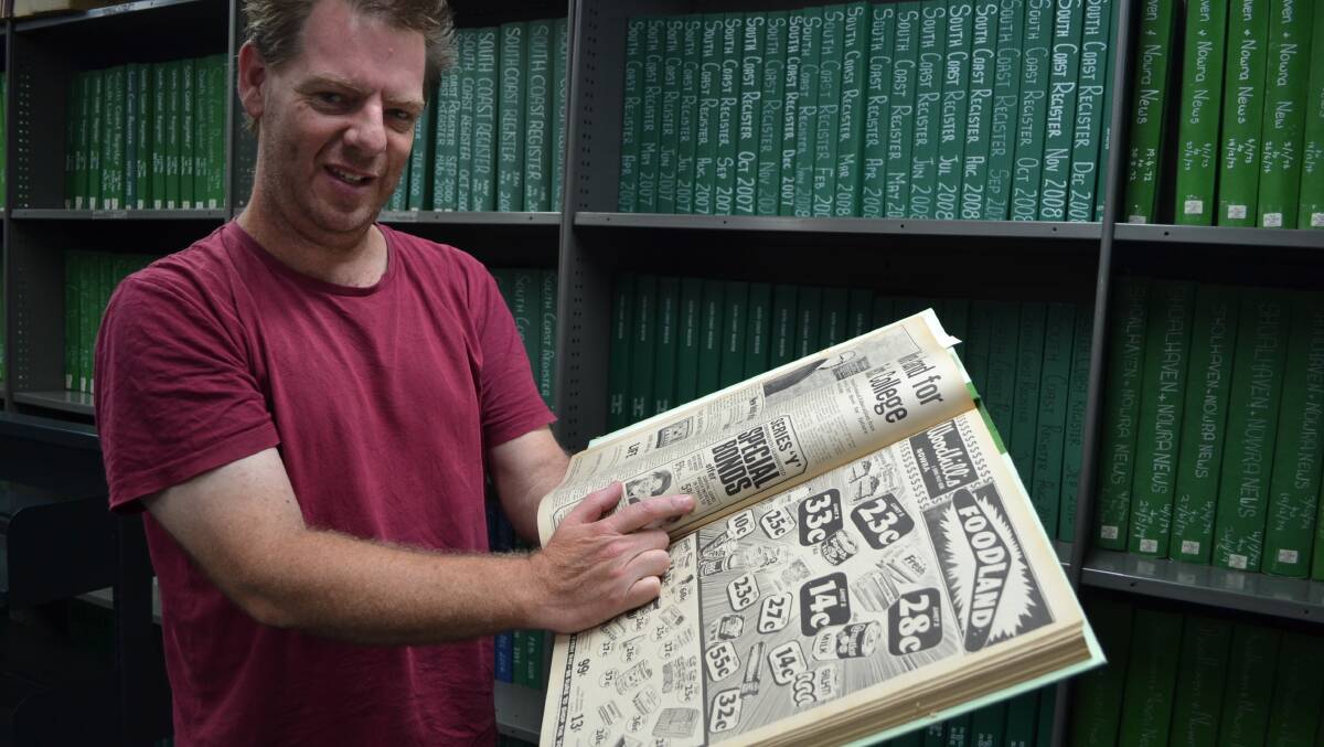 HISTORY BUFF: Adrian Morgan with some of the South Coast Register archives he is hoping to digitise and put on his Facebook page – Shoalhaven in the 20th century.