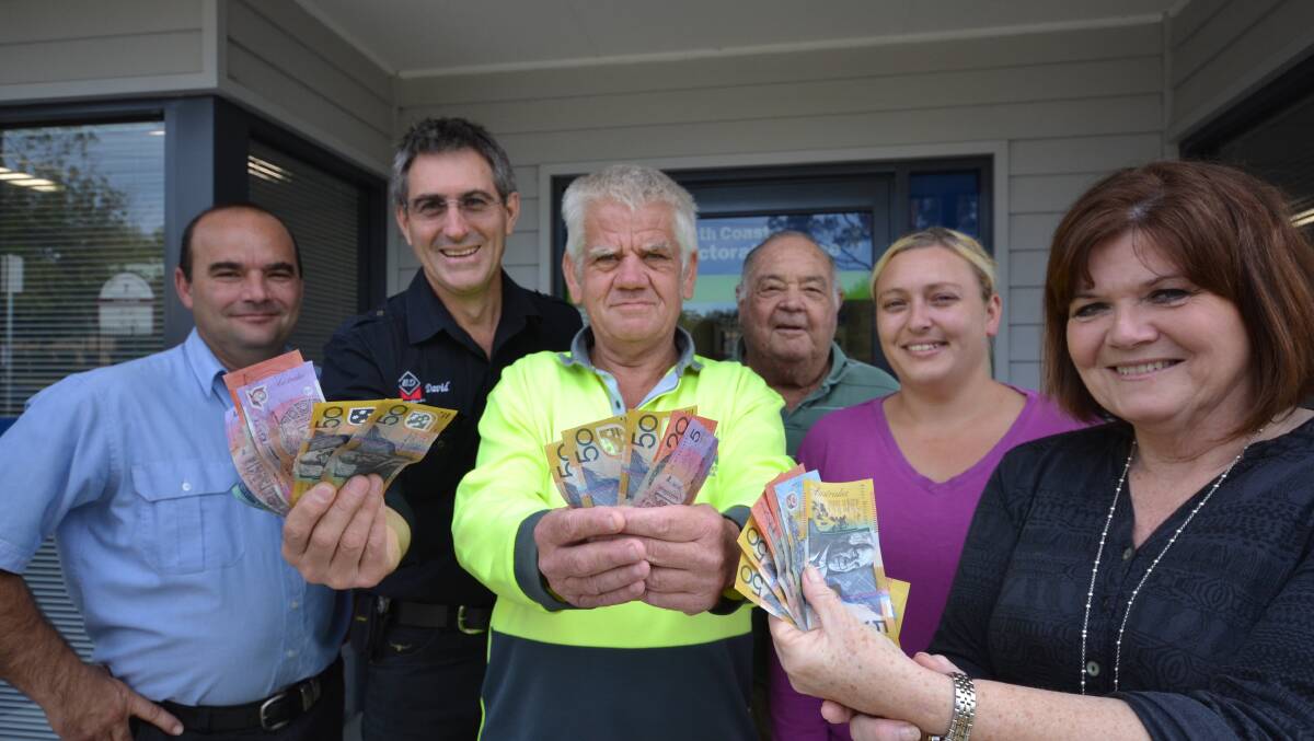 COMMUNITY EFFORT: Donate a Bale campaign organisers Jason Schuman and David Bennett with St Vincent de Paul Jim da Silva Farm residents Laurie Piper and Anthony Nolan, case worker Tabitha Hart and South Coast MP Shelley Hancock with the latest donation to the campaign.