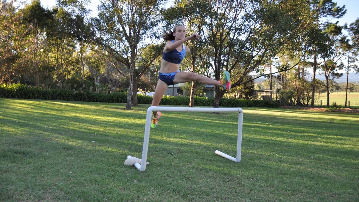 JUMP FOR JOY: Rosie-May Davidson hones her steeple chase skills at her Shoalhaven Heads home following a national gold medal.