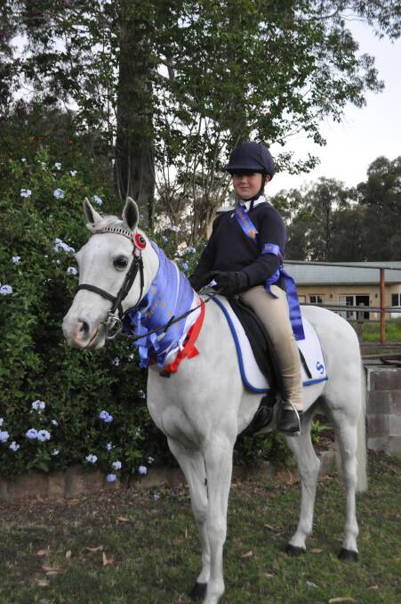 STAR RIDER: Isabella Errington shows off her ribbons from the Berry gymkhana on Annie.