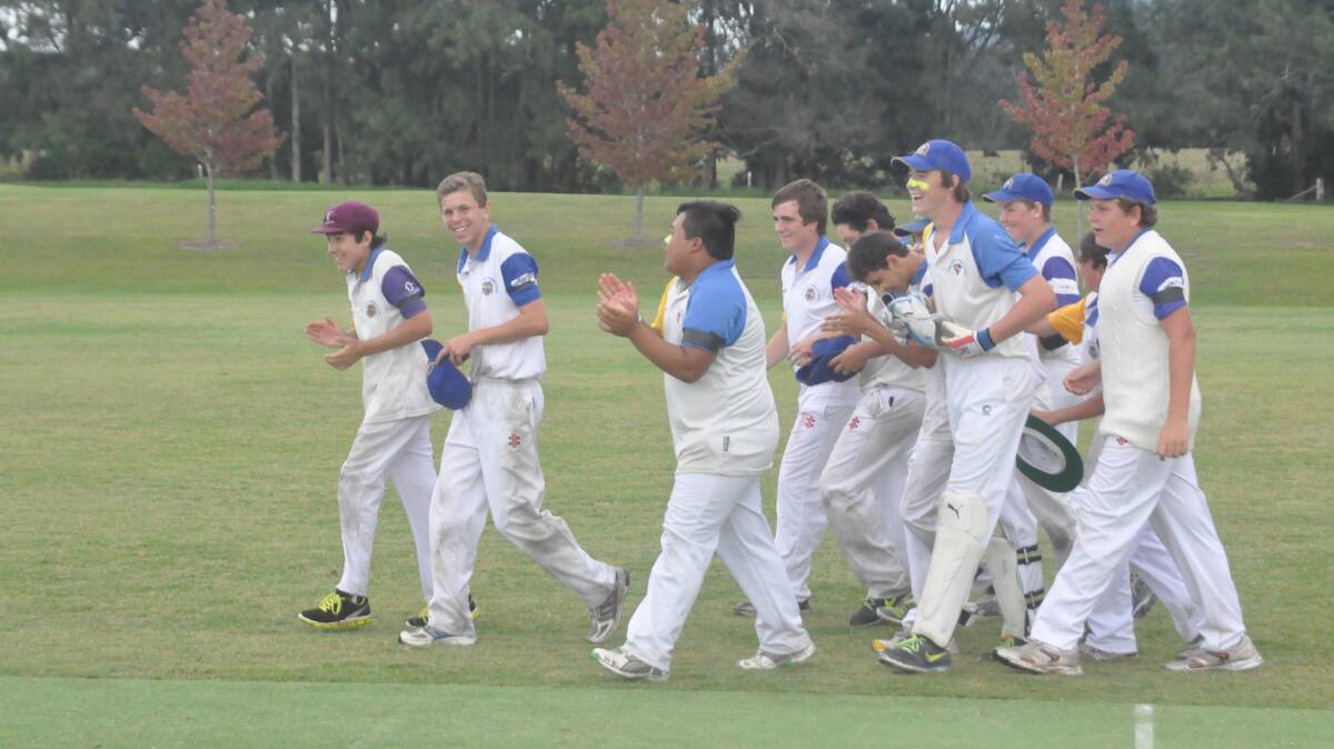MAGIC MOMENT: Bomaderry under 16s celebrate another wicket during their grand final triumph over North Nowra-Cambewarra. Photo: DAMIAN McGILL 