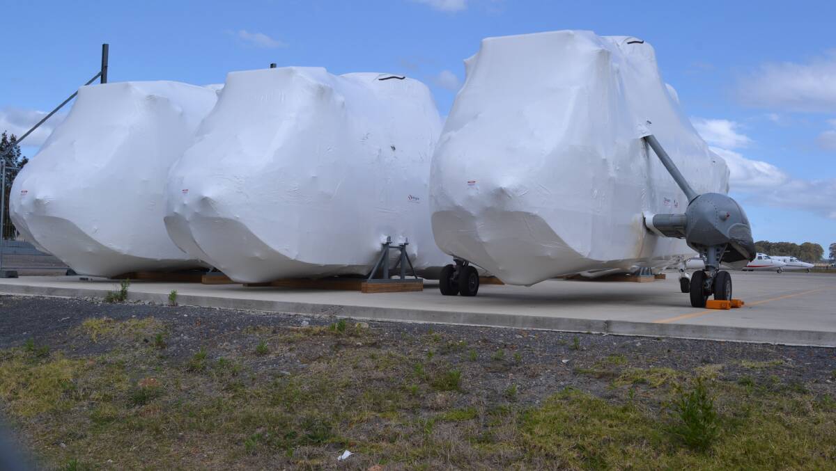 WRAPPED AND READY: The Sea Kings wrapped in plastic ready for their final journey out of Nowra.