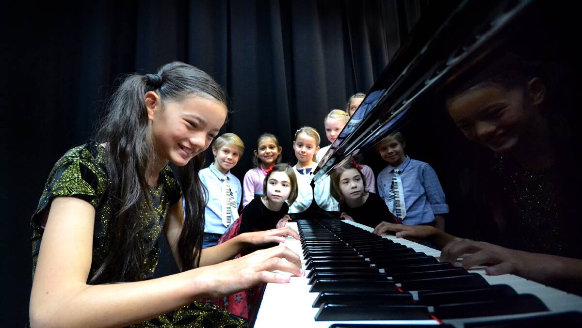 KEYED IN: Layla Wang, Amelie Ziino, Lucas Charalambous, Julaiha Kallus, Amelia Sim, Molly Jones and Andrew Charalambous at the Nowra School of Arts on Thursday during the piano championships.