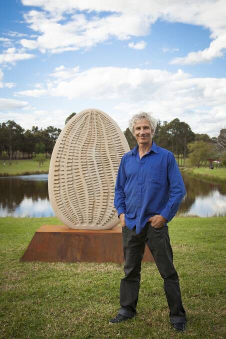 WINNER: Berry artist Michael Purdy is proud to have won the 2014 University of Western Sydney’s UrbanGrowth NSW Acquisitive Sculpture Award with his sandstone piece Oneness. Photo: UNIVERSITY OF WESTERN SYDNEY