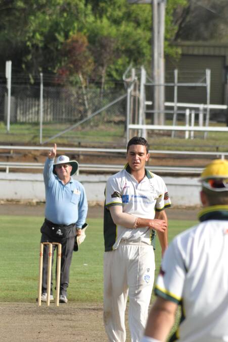 DERAILED: Umpire Bob Roach raises his finger to signal the end of Kurt Quinlan’s innings as Lain Beckett ripped through with figures of 7/25 during Shoalhaven Ex-Servicemen’s defeat of Nowra.  Photo: PATRICK FAHY 