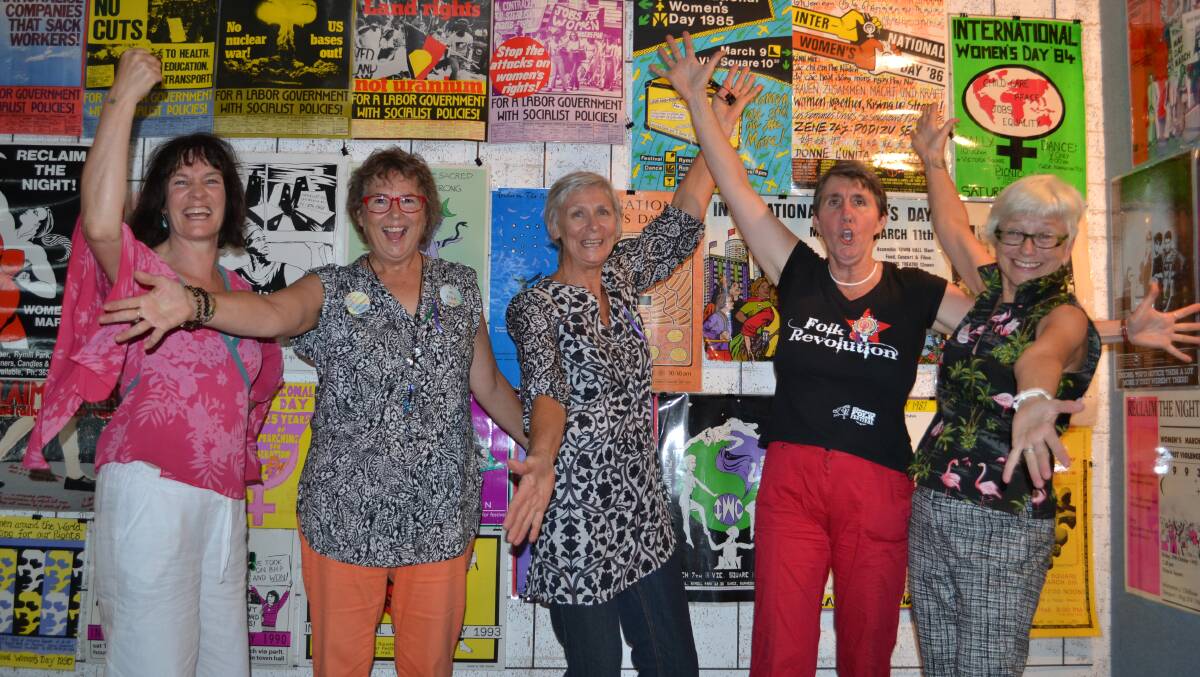 POSTER POWER: Squid Studio manager Lissa-Jane de Sailles, Karen Grimes from North Nowra, Shoalhaven International Women’s Day Committee members Lyn Wallin and Marg McHugh and Sydney designer Chia Moan in front of Squid Studio’s political poster exhibition.