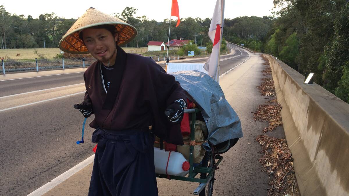 RELIEF: Yuuichi Iwata walking through the Southern Shoalhaven on the weekend.