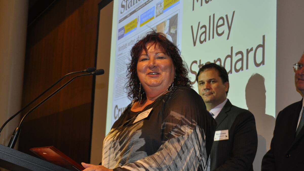 Sharon Hansen, Murray Valley Standard, picks up the Best Newspaper award for circulation 2,500 - 6,000 at the 2014 Country Press Awards. Photo: Joanne Fosdike.