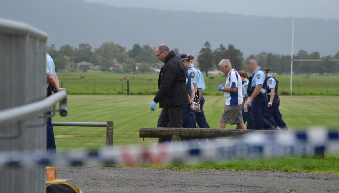 HUNT FOR EVIDENCE: Police conduct a line search at Lyrebird Park on Wednesday morning.