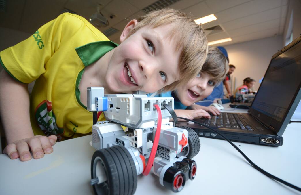 SMILES AND SCIENCE: Daniel Sim and Harrison Shepherd take their first steps on the path to becoming robotics engineers. 