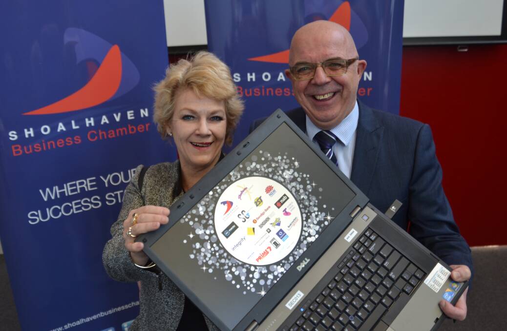 AWARDS LAUNCH: Shoalhaven Business Chamber general manager Jennifer Stewart and president Warren Seccombe reveal the new Shoalhaven Business Awards logo at the event launch on Friday.
