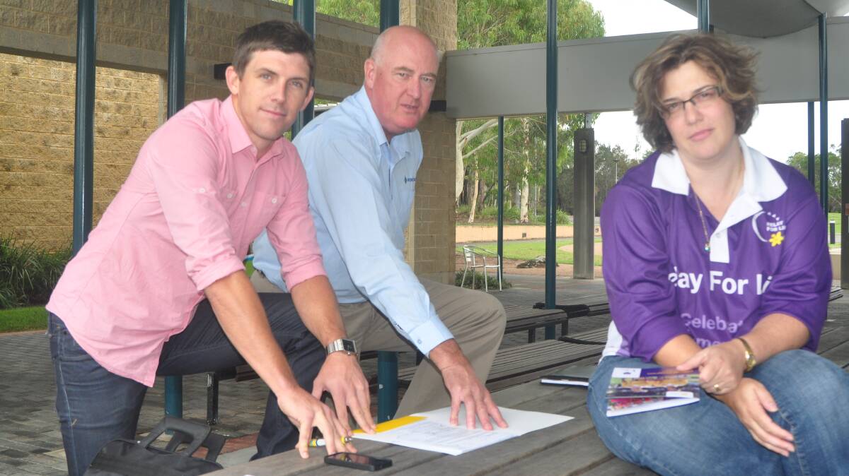 ACTION STATIONS: Cancer Council community relations co-ordinator Terry Deegan, Shoalhaven Nowra Relay for Life committee member Greg Brennan and chairperson of the Shoalhaven Nowra Relay For Life committee Kimberley McMahon-Coleman work on organising a reduced relay.