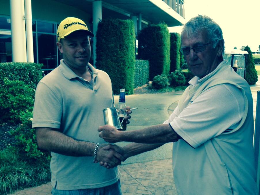 I’LL DRINK TO THAT: Monthly mug winner Ben Bassett (left) being presented with the cup by captain Brian Dwyer, after his 66 nett at Worrigee Links last Saturday.  