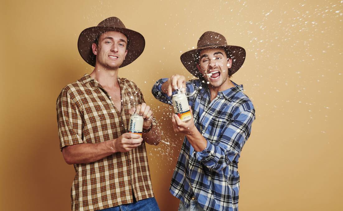 Aussie brew: Jack Steele and Matt Ford sample of can of their no carb, no sugar Better Beer. Image: Supplied. 