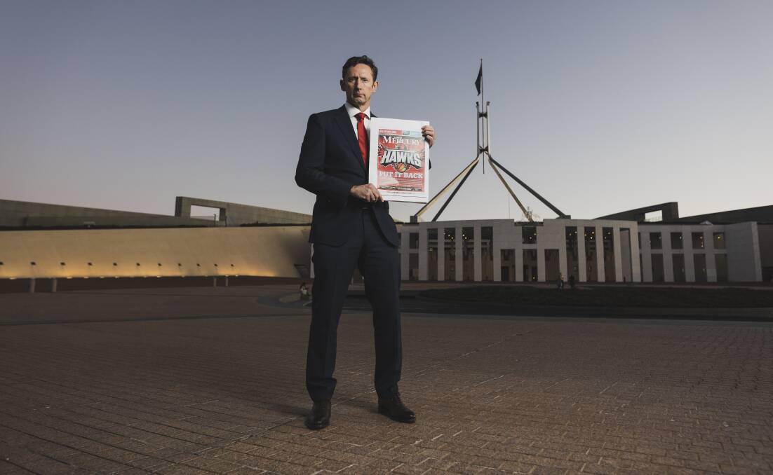 FIGHTING FOR HIS CLUB: Federal Member for Whitllam, Stephen Jones at the front of Parliament House, with the petition calling on the NBL to put the Illawarra name back in. Picture: Dion Georgopoulos - THE CANBERRA TIMES, ACM.