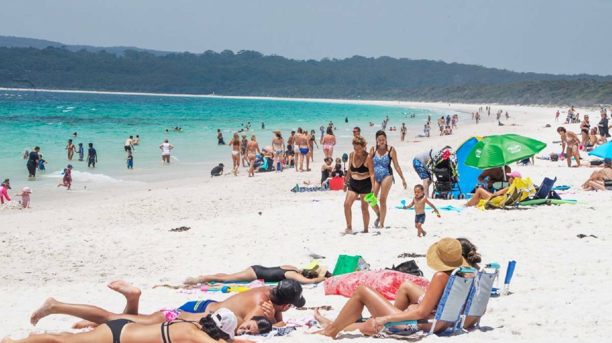 A crowd of visitors pack onto Hyams Beach during summer. Photo: file. 