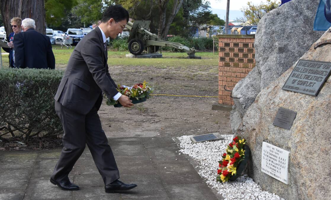 South Korean Deputy Consul General Su-chang Cho laying a wreath at the memorial service.