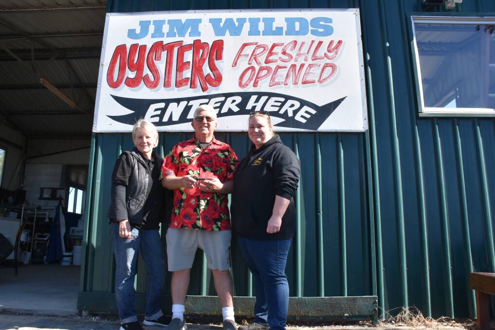 Robyn and Jim Wild with their daughter Sally MacLean in August 2019 just after she had been crowned Australia's Fastest Oyster shucker at an oyster farmers conference in Foster.
