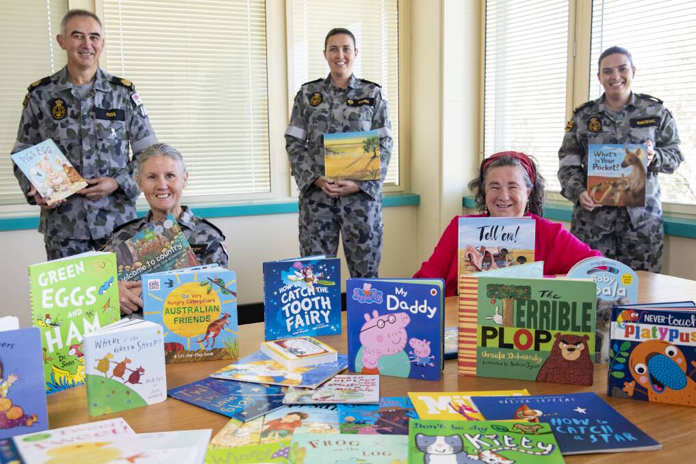 Albatross personnel who orgainised the National Reconciliation Week book drive with some of the books that were donated for the Boori Preschool. HMAS Albatross Command Warrant Officer Gary Fuss, Chief PO Linda Eddington, PO Megan Cahill, Ms Dallas McMaugh, LS Kara Knezevic. Photo: CPOIS Cameron Martin.