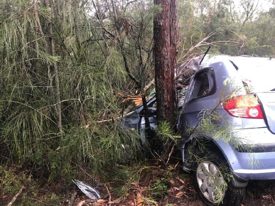 A car crashed into a tree on Naval College Road in Vincentia. Photo: St Georges Basin RFS. 
