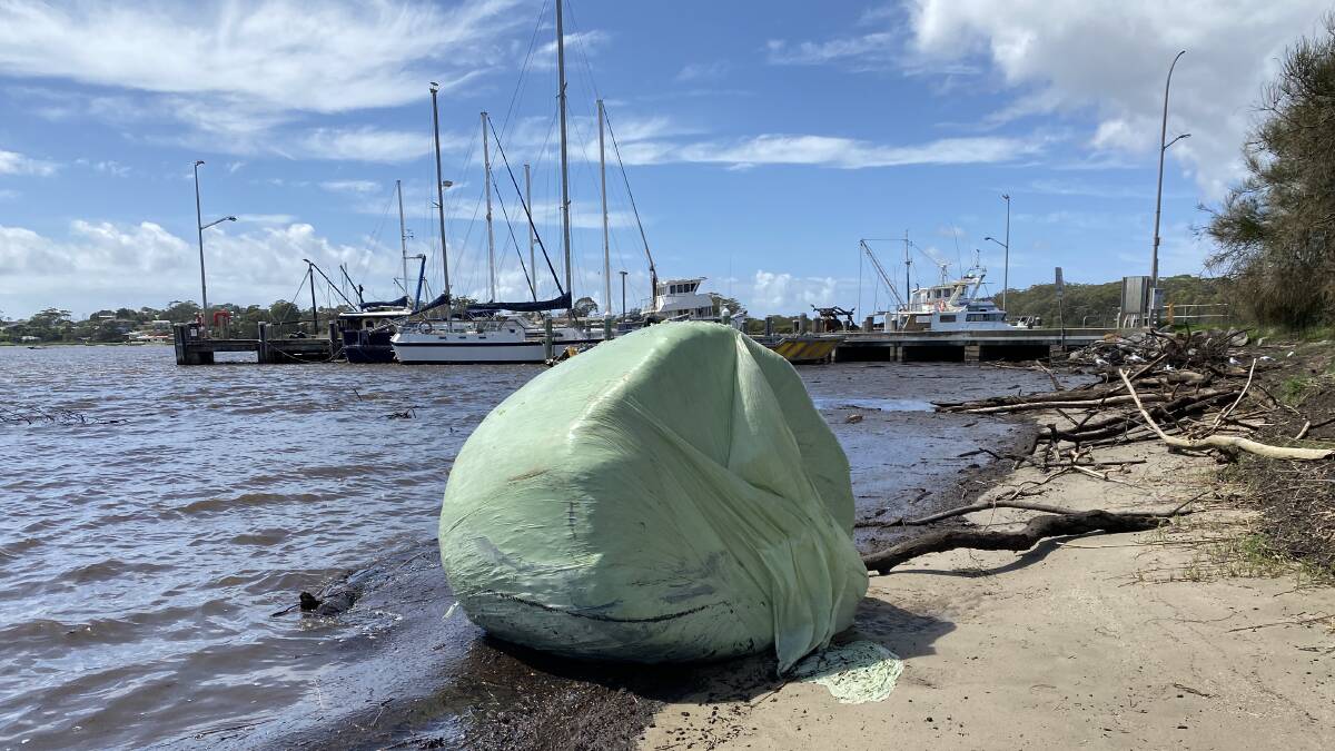 A silage bale washed up near the main wharf in Greenwell Point.