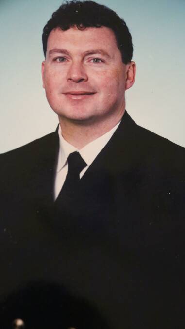 Commander Spurgin recognised for legal service in navy