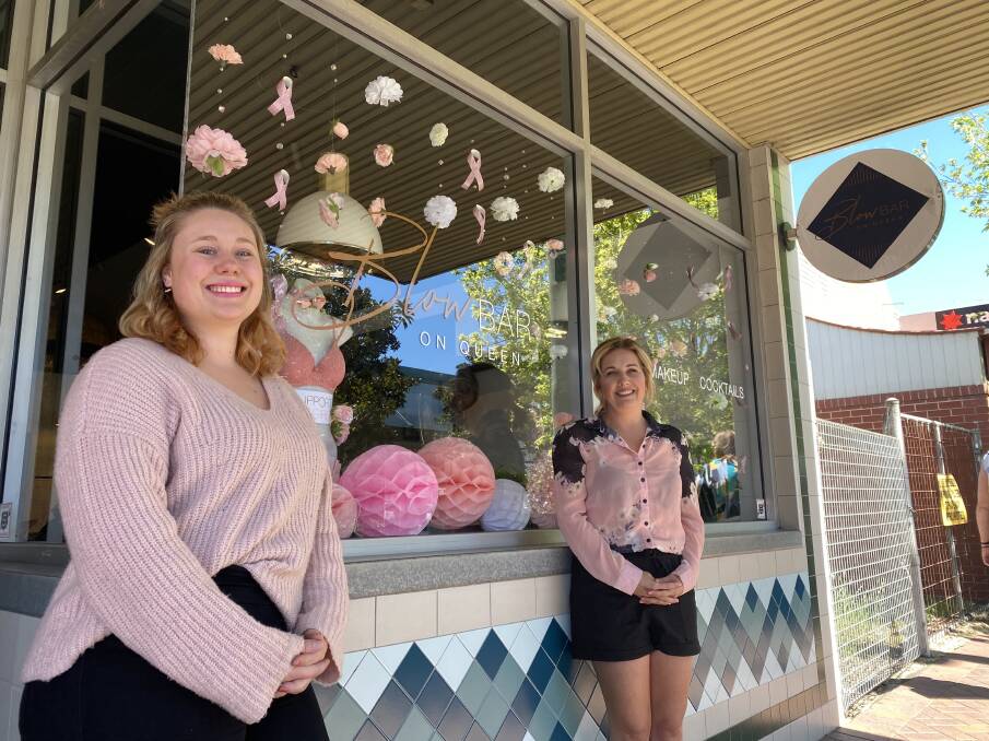 Teyarna Woods and Kyra Florance from the Blow Bar on Queen, one on the shops in Berry turning pink.