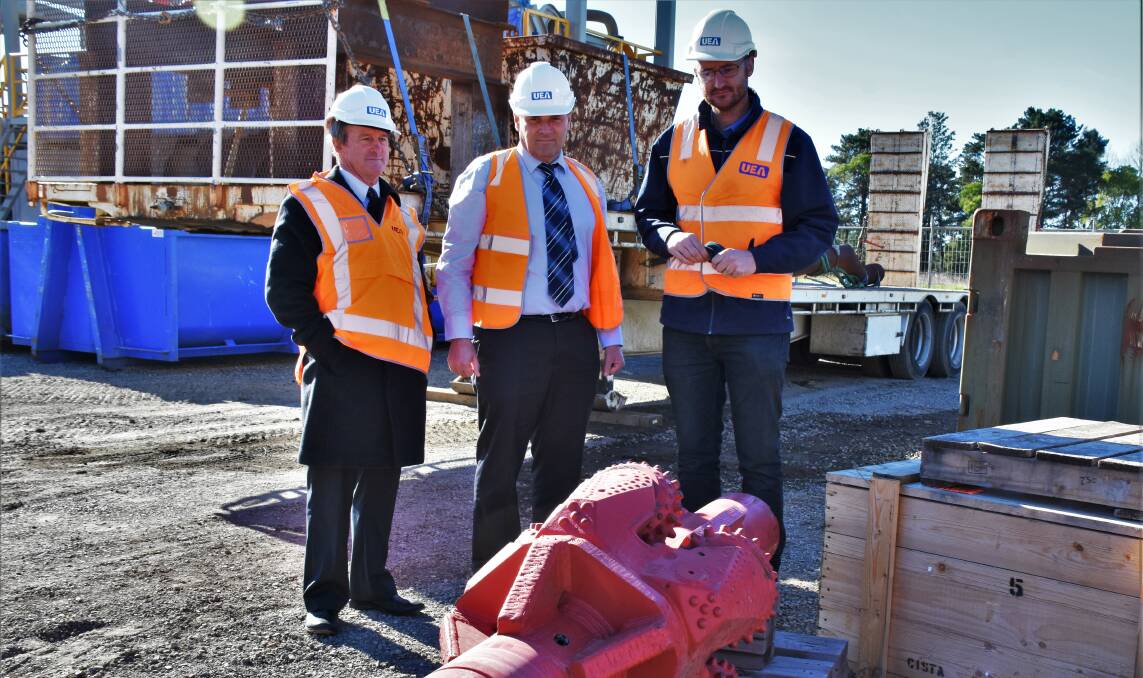 Cr Mark Kitchener, Shoalhaven Water asset planning and development section manager Robert Horner and Operations Manager at UEA Jonathan De Vos standing in front of a $100,000 reamer imported from the USA. 