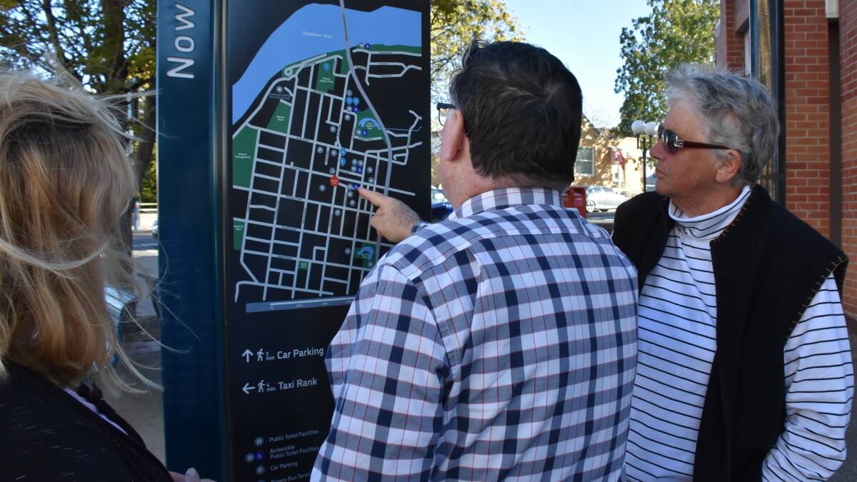 Deputy Mayor Cr Patricia White, Chairman of the Nowra CBD Revitalisation Committee James Caldwell and Cr Joanna Gash discussing the new sign. 